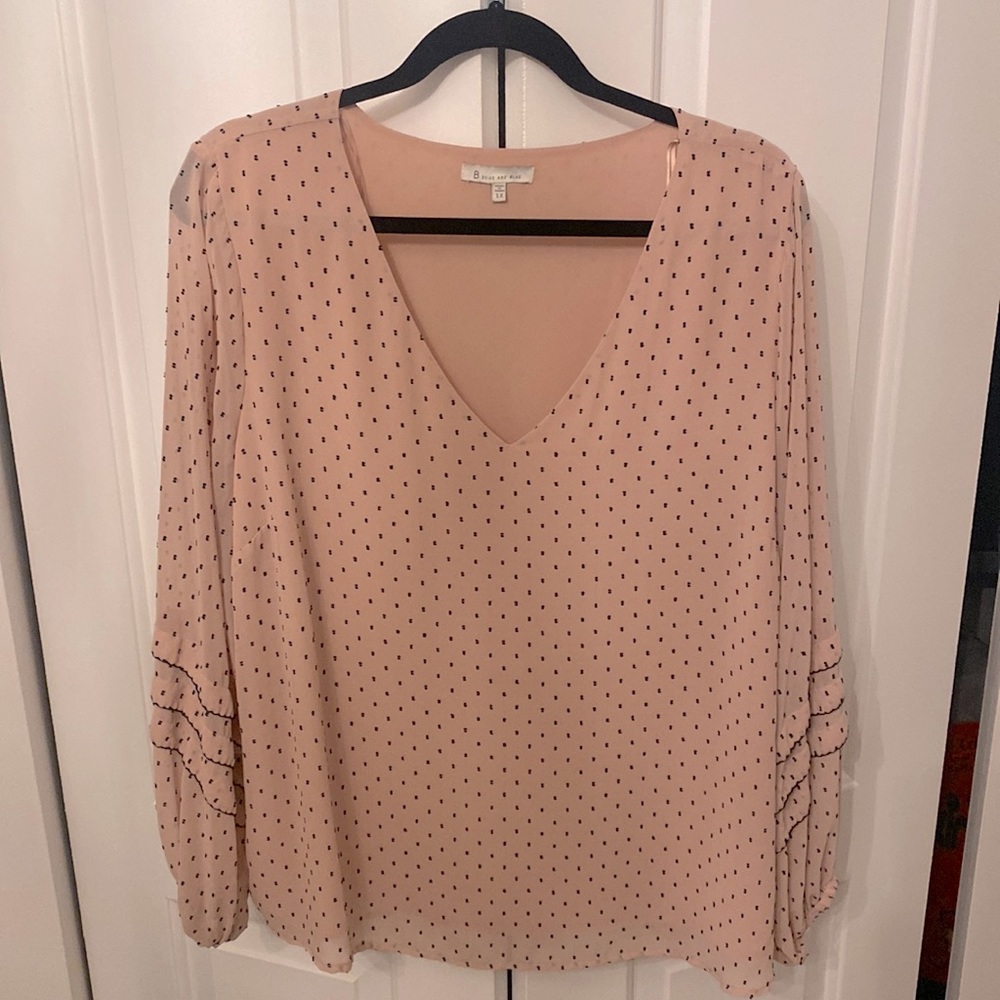 Pink v-neck top with sheer sleeve detail